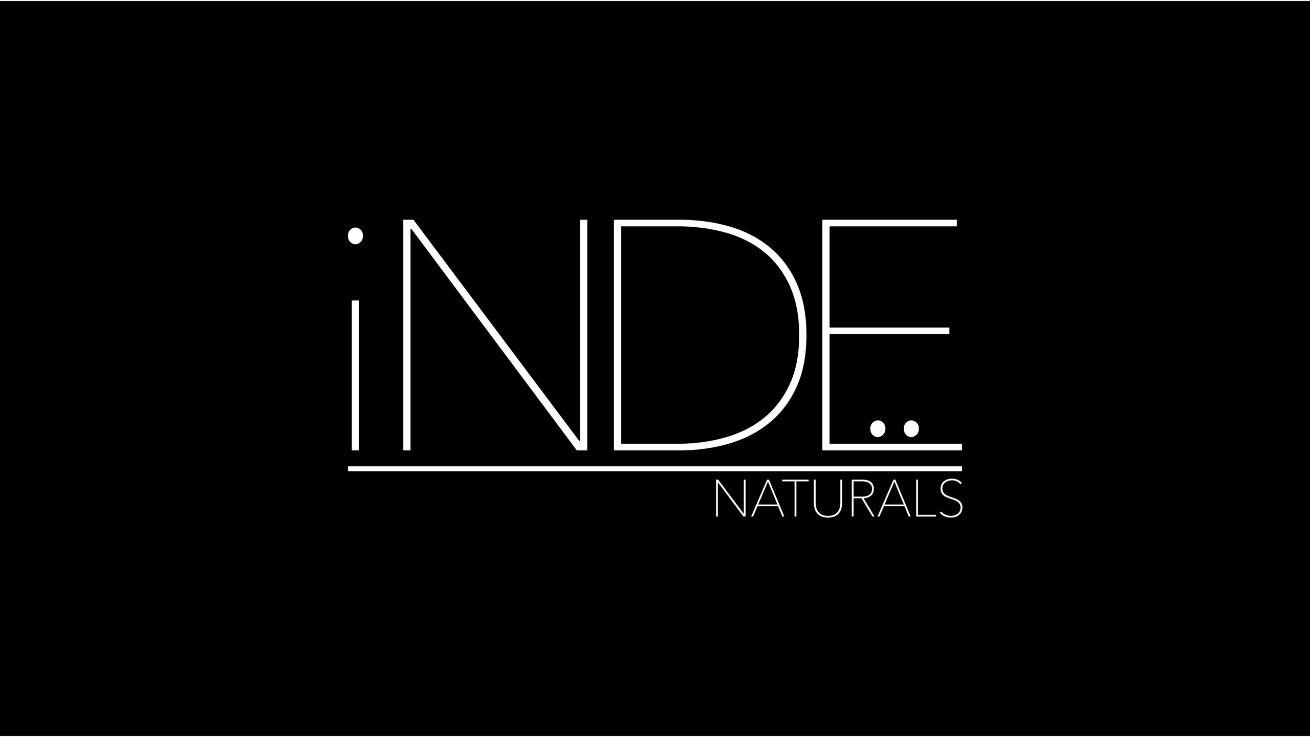 Inde Naturals logo in white on black background with minimal typography